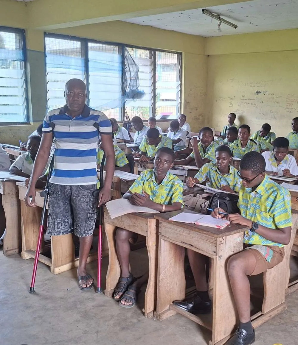 School teacher in Ghana with in-motion underarm crutches
