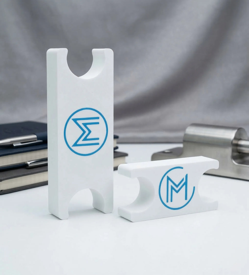 3D-printed white holders with blue logos.