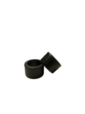 Two black rubber bushings stacked together