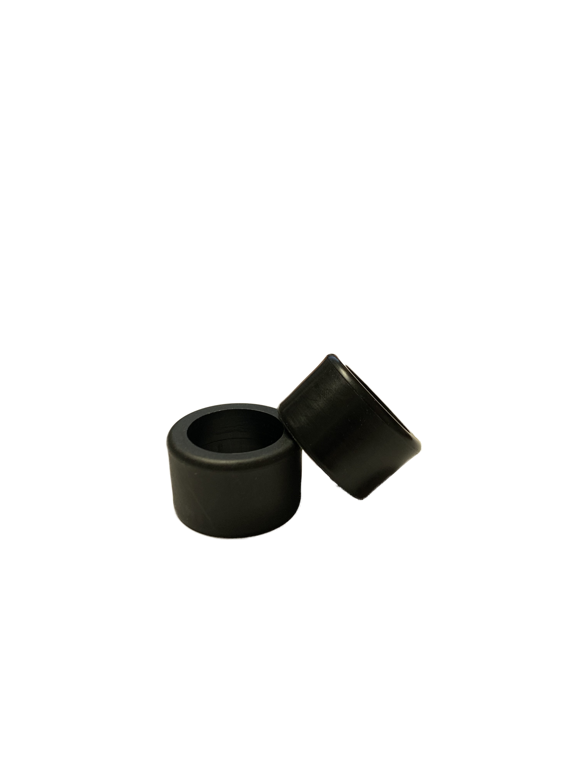 Two black rubber bushings stacked together