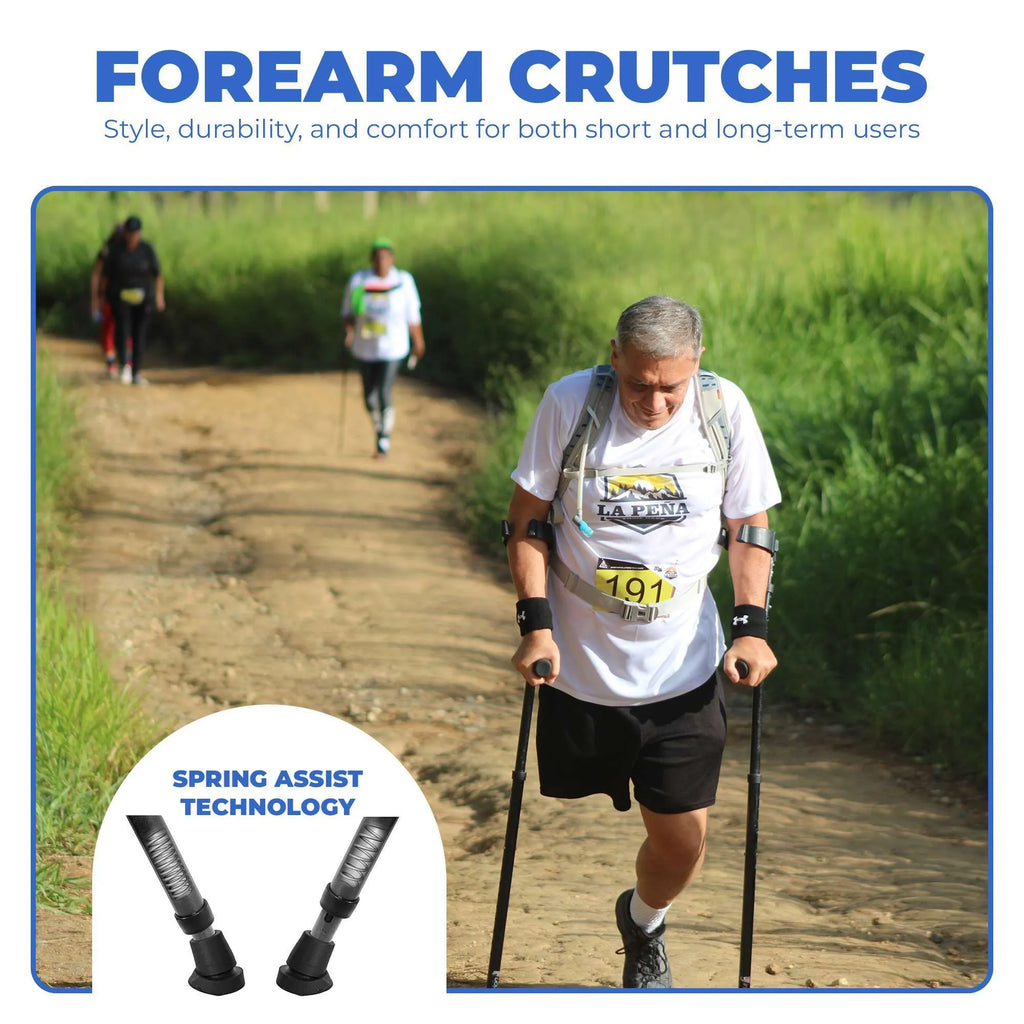 Man using spring assist forearm crutches outdoors.