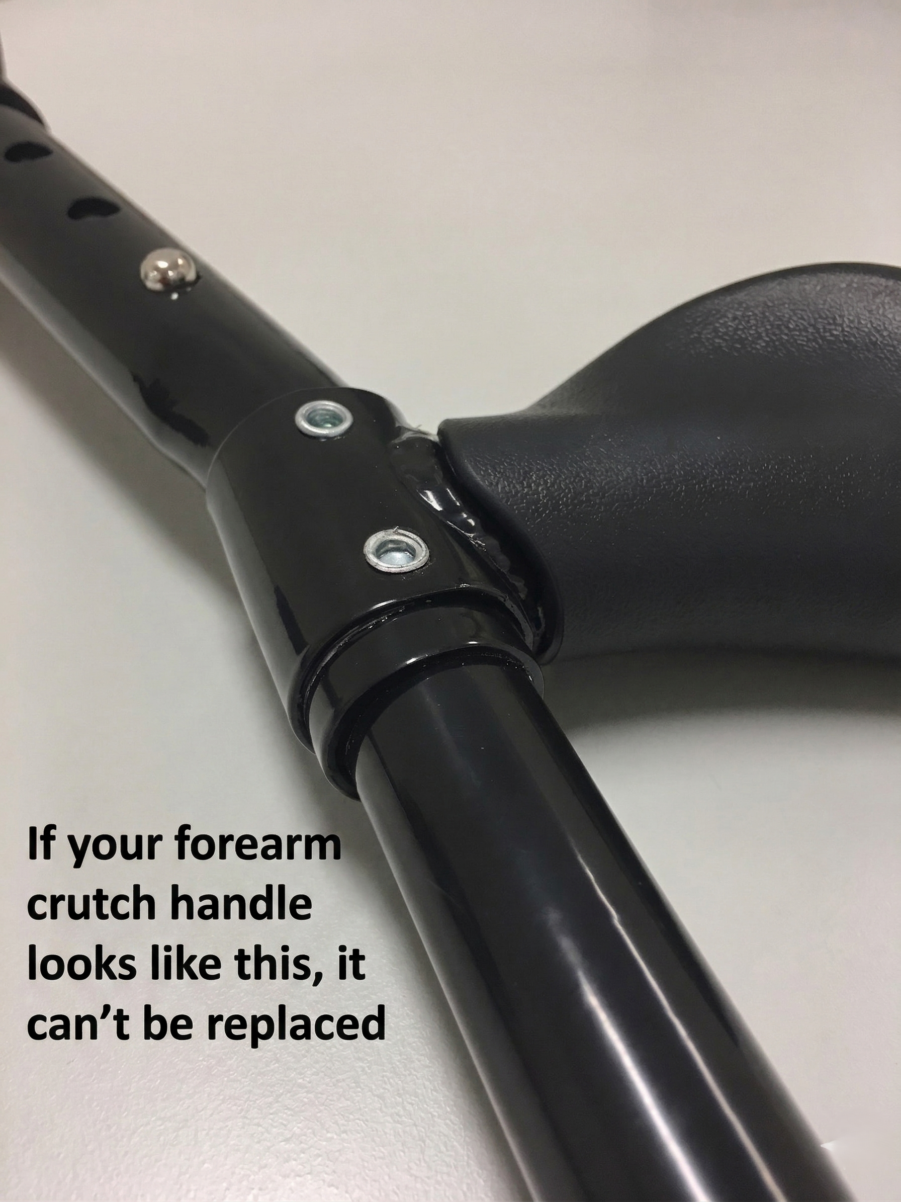 Forearm crutch handle with repair warning